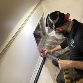 technician is working inside the home.